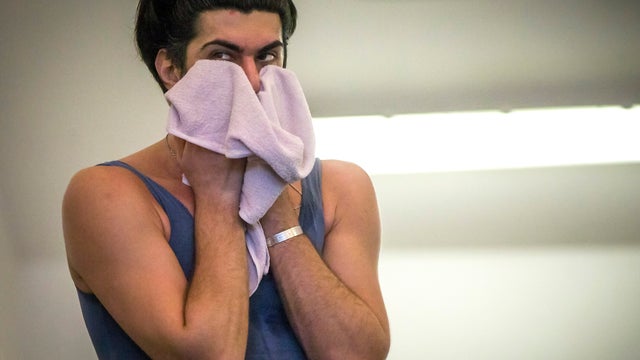 Bolshoi ballet dancer Nikolai Tsiskaridze wipes sweat from his face as he holds a rehearsal in the Bolshoi Theater in Moscow Feb. 14, 2013. 