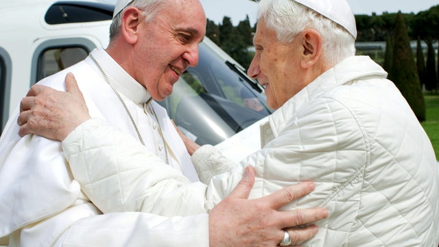 Pope Francis, left, meets Pope Emeritus Benedict XVI in Castel Gandolfo, Italy, March 23, 2013, in this picture provided by the Vatican paper L'Osservatore Romano. 