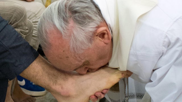 Pope Francis kisses the foot of an inmate at the juvenile detention center of Casal del Marmo, Rome, on March 28, 2013. 