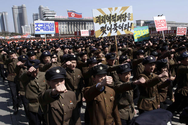 North Koreans march through Kim Il Sung Square 