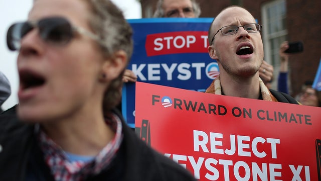 Hundreds of protesters staged a demonstration against war and the Keystone XL pipeline near fundraiser where President Obama was to speak on April 3, 2013 