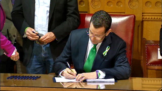 Conn. signs sweeping gun restrictions into law 
