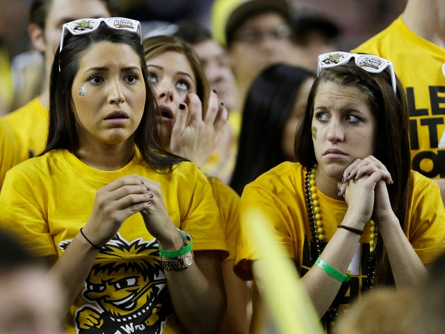 Wichita State fans watch the second half of a NCAA Final Four tournament college basketball semifinal game against Louisville April 6, 2013, in Atlanta. 