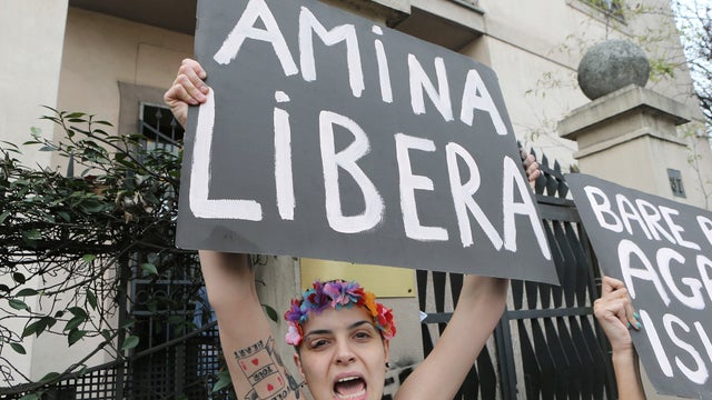 A FEMEN activist protest in front of the Tunisian Consulate in Milan, April 4, 2013.  