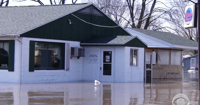 Rain and snow in forecast for towns hit by Midwest flooding - CBS News