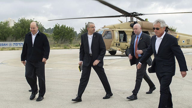Secretary of Defense Chuck Hagel, right, walks with Israeli Minister of Defense Moshe Yaalon, far left 
