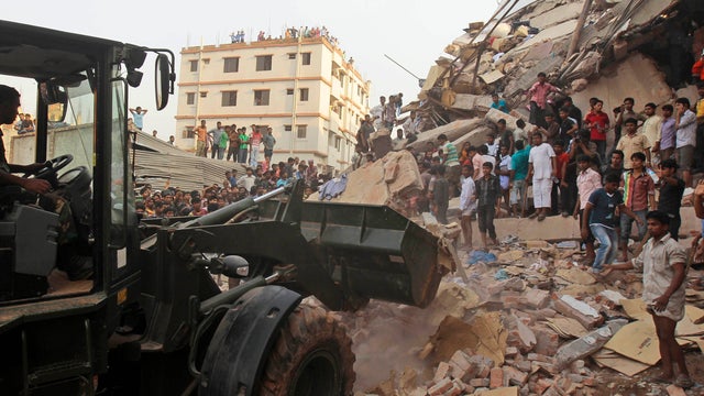 Bangladeshi soldiers use earth mover during rescue operation at site of factory collapse in Savar, near Dhaka, Bangladesh, April 24, 2013. At least 161 people were killed.  