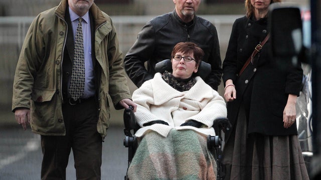 Terminally ill Marie Fleming, 58, arriving at the High Court in Dublin with L-R her partner Tom Curran, family friend Brian Gainey and daughter Corrina Moore on January 10, 2013.  