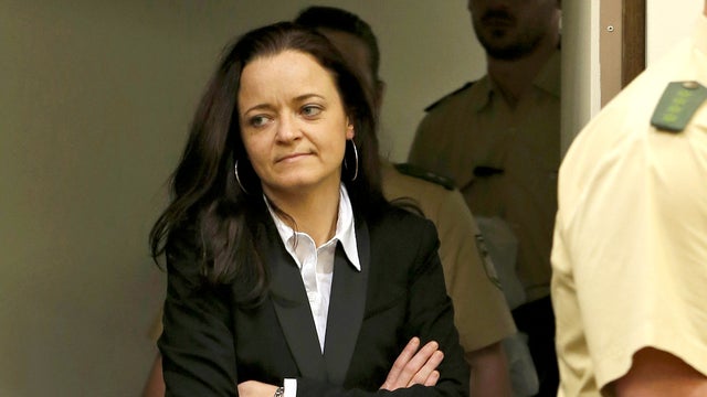Beate Zschaepe, member of the neo-Nazi group National Socialist Underground (NSU) enters the court room before the start of her trial in Munich, southern Germany, Monday, May 6, 2013.  
