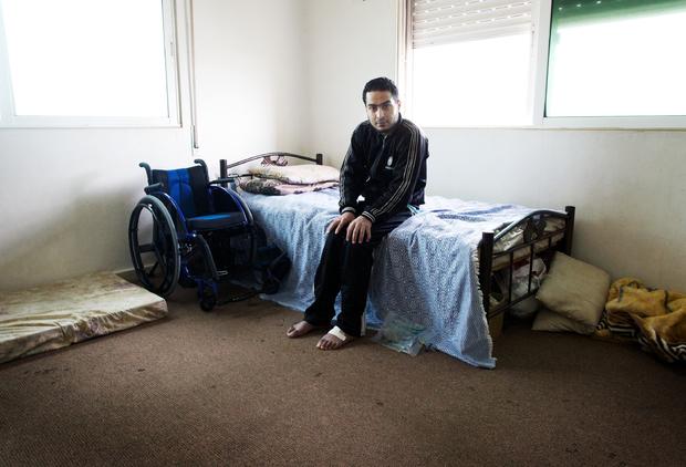 Shaher, a Syrian rebel who was paralyzed by a gunshot 