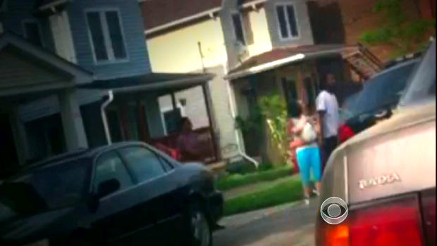 Cell phone video captures Amanda Berry and her child in their first moments of freedom outside Ariel Castro's home. 