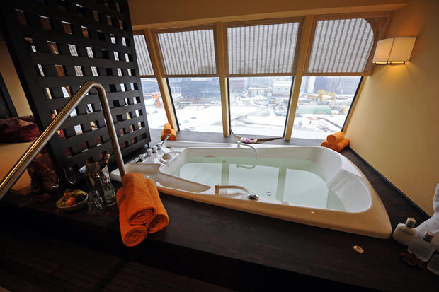 A bathtub can be seen in a wellness suit 