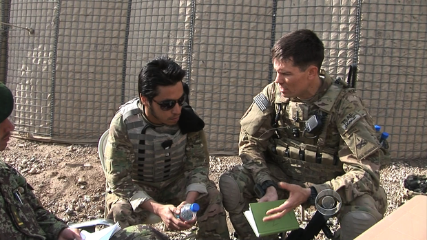 U.S. soldiers in Afghanistan discuss a plan to bring Afghan soldiers with them on a search for roadside bombs. 