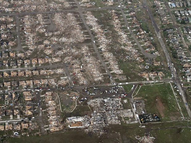 This aerial photo shows the remains of homes hit by a massive tornado in Moore, Okla., Monday May 20, 2013 