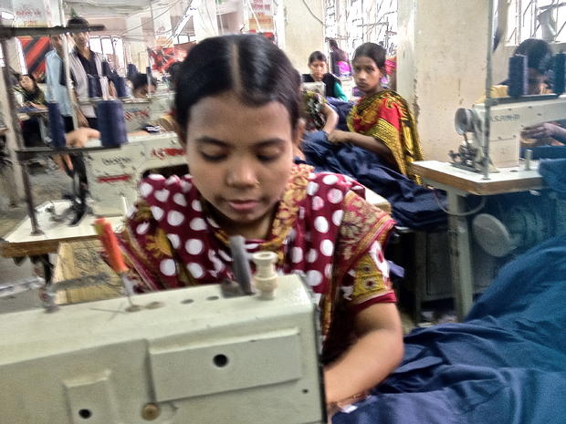 A young woman works at a garment factory in Dhaka 