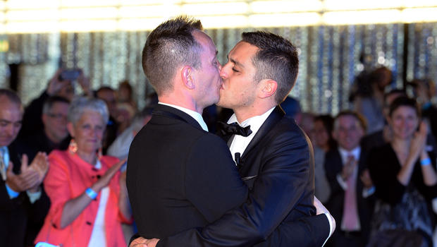 Vincent Autin (L) and Bruno Boileau kiss during their marriage, France's first official gay marriage, at the city hall in Montpellier on May 29, 2013. 