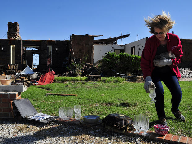 Ruth Magers recovers some dishes June 1, 2013, in El Reno, Okla., from what is left of her friend Bobbie Steenbergen's home that was destroyed by the tornadoes that swept through Central Oklahoma. 