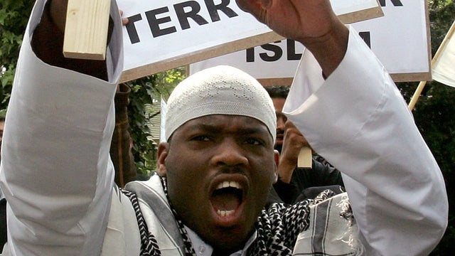 Michael Adebolajo shouts slogans as Muslims march in a London protest April 27, 2007. 