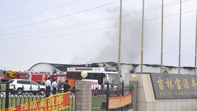 Photo released by China's Xinhua News Agency shows smoke rising from poultry farm where fire killed at least 55 people June 3, 2013 