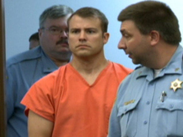 ExKansas cop accused of killing wife