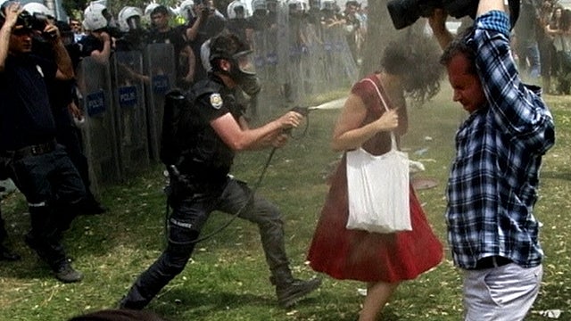 The photo of the woman in Turkey being pepper-sprayed by police. 