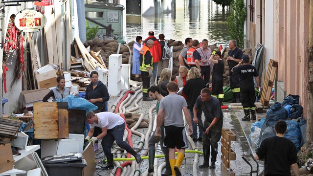 People clear up the streets in Passau, southern Germany 