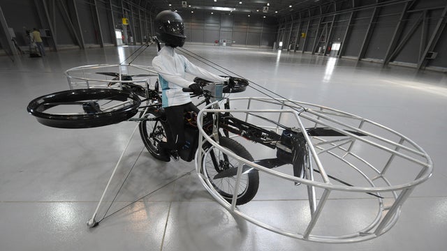The remote-controlled Flying Bike with a test dummy is ready for its during presentation fly in Prague on Wednesday, June 12, 2013.  