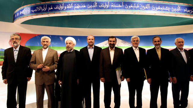 Iranian presidential candidates pose for a group picture after a live debate on state TV in Tehran 