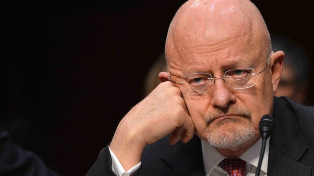 Director of National Intelligence James Clapper, in a March 2013 file photo, denied that NSA analysts snoop on Americans' communications without "proper legal authorization," but did not say what "proper legal authorization" might be. 