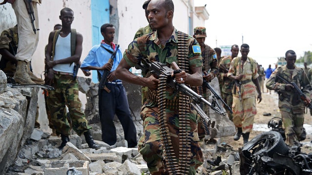 Somali National Government soldiers are seen after al Qaeda-linked al-Shabab insurgents shot and blasted their way into the United Nations compound in Mogadishu, Somalia, June 19, 2013. 