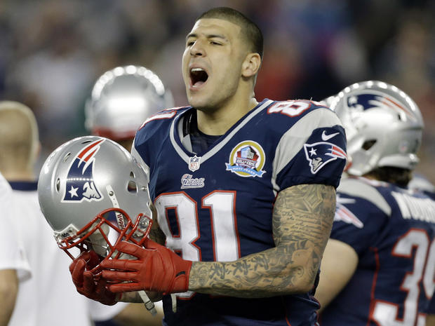 In December 2012 file photo, New England Patriots tight end Aaron Hernandez reacts during the second quarter of an NFL football game against the Houston Texans in Foxborough, Mass. State and local police spent hours at the home of New England Patriots tig 