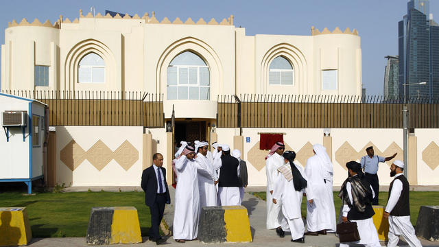 Guests arrive for the opening ceremony of the new Taliban political office in Doha 