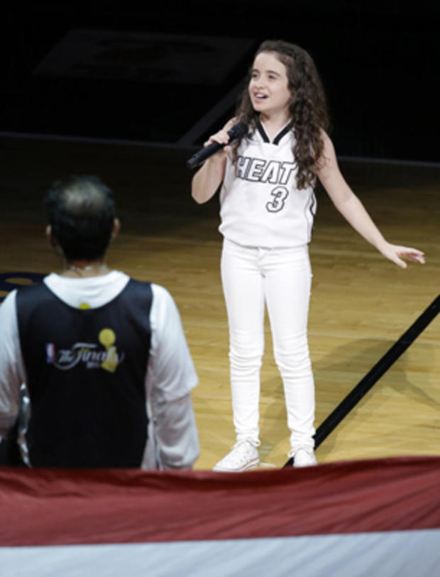 Julia Dale sings the national anthem before the first half in Game 7 of the NBA basketball championships between the Miami Heat and the San Antonio Spurs, Thursday, June 20, 2013, in Miami. 