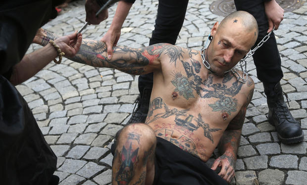 Animal rights activist in Prague being branded. 