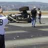This photo released the National Transportation Safety Boards shows an NTSB officer at the scene where an Asiana Airlines flight crashed at San Francisco International Airport. 