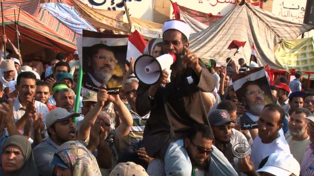 Supporters of ousted Egyptian President Mohammed Morsi in Tahrir Square, Cairo, on July 9, 2013 protest the military's recent takeover. 