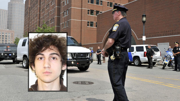A U.S. Marshal's van, believed to be carrying Boston Marathon bombing suspect Dzhokhar Tsarnaev, arrives at the federal courthouse for his arraignment Wednesday, July 10, 2013, in Boston. 
