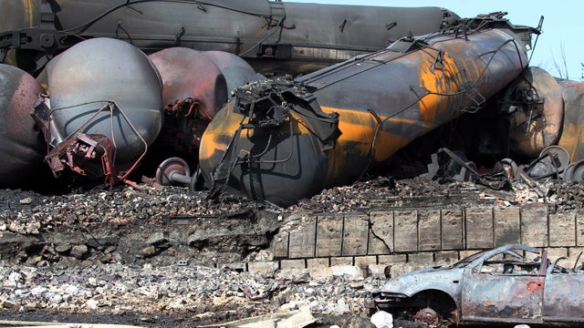 This picture provided by Surete du Quebec shows wrecked oil tankers and debris from a runaway train July 8, 2013, in Lac-Megantic, Quebec, Canada. 