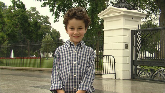 NICOLAS_CUTE_IN_FRONT_OF_WH.jpg 