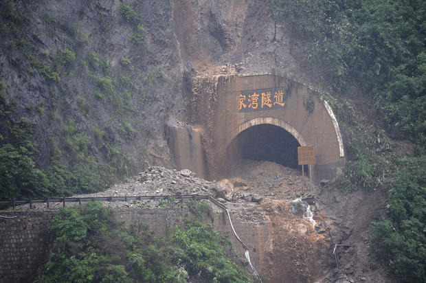 A Chinese highway tunnel is blocked by a rain-triggered landslide in Wenchuan, Sichuan province 