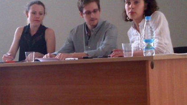NSA leaker Edward Snowden attends a press conference at Moscow's Sheremetyevo Airport with Sarah Harrison of WikiLeaks, left, July 12, 2013, in this image provided by Human Rights Watch. 
