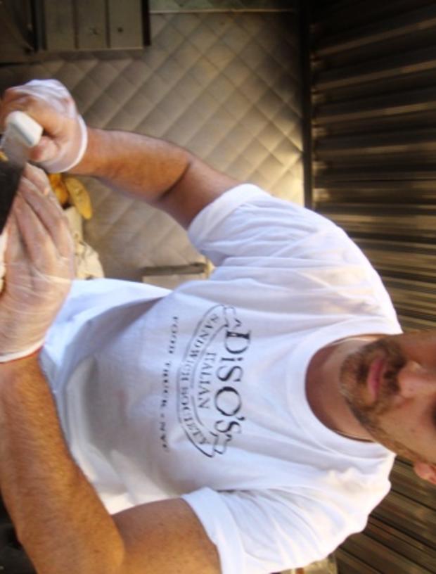 Andy Slicing Porchetta At DiSO'S Italian Sandwich Society 