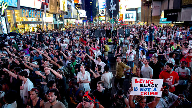 Throngs of marchers gather on Times Square, July 14, 2013, in New York, for a protest against the acquittal of volunteer neighborhood watch member George Zimmerman in the 2012 killing of 17-year-old Trayvon Martin in Sanford, Fla. 