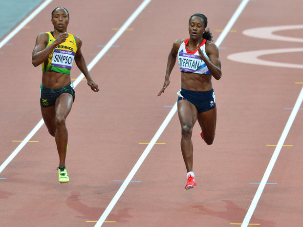 Jamaica's Sherone Simpson (left) and Britain's Abiodun Oyepitan compete in the women's 200m heats during the London 2012 Olympic Games 
