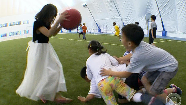 Kids play in the dome built by the International School of Beijing. 