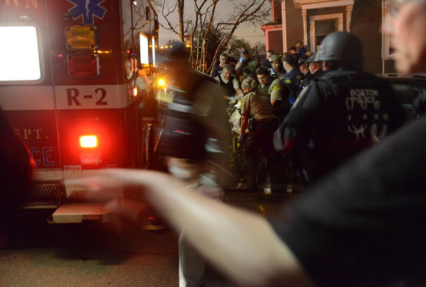 Medical personnel prepare to put Dzhokhar Tsarnaev into an ambulance on April 19, 2013. 