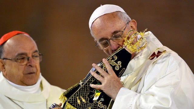 Pope Francis celebrates Mass at the Basilica of the National Shrine of Our Lady Aparecida on July 24, 2013 in Aparecida, Brazil. The shrine attracts millions each year and honors the dark-skinned Virgin of Aparecida, who is considered the patron saint of  