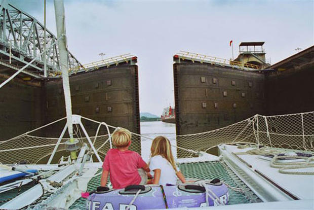 Jack and Camille watch as the locks of the Panama Canal open to the Pacific Ocean and the adventures ahead. 