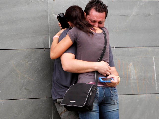 Relatives of the victims involved in a train accident react at a victims information point in Santiago de Compostela, Spain, July 25, 2013. 