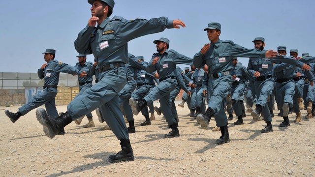 Afghan National Police (ANP) cadets march during their graduation ceremony  